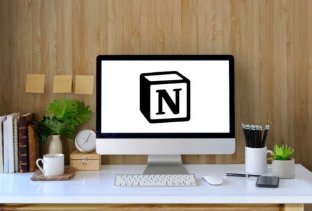 Notion logo on computer screen, displaying code. Learn how to use Notion for efficient organization