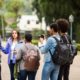 female tour guide talking to a group of young people