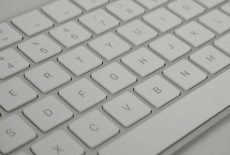 white computer keyboard displaying letters, used for transcription from home
