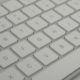 white computer keyboard displaying letters, used for transcription from home